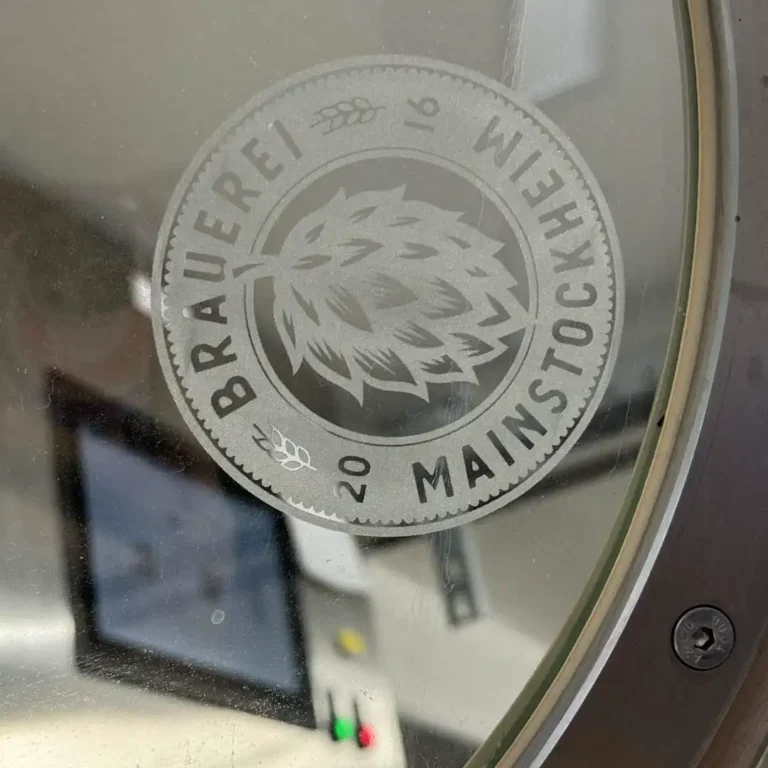 The Mainstockheim Brewery logo on the lid of the brewing kettle